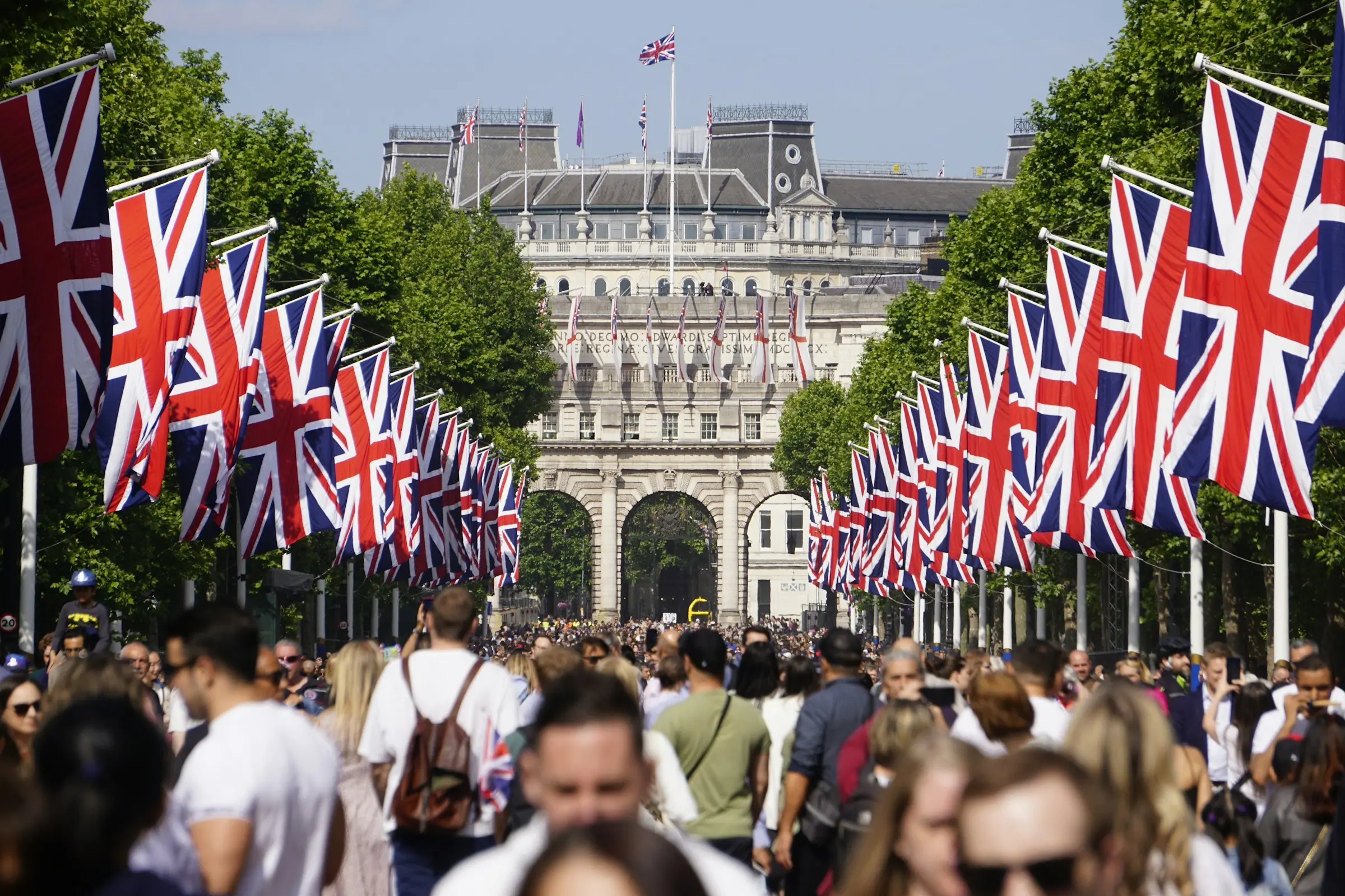 A huge crowd filling The Mall under rows of Union Jacks
